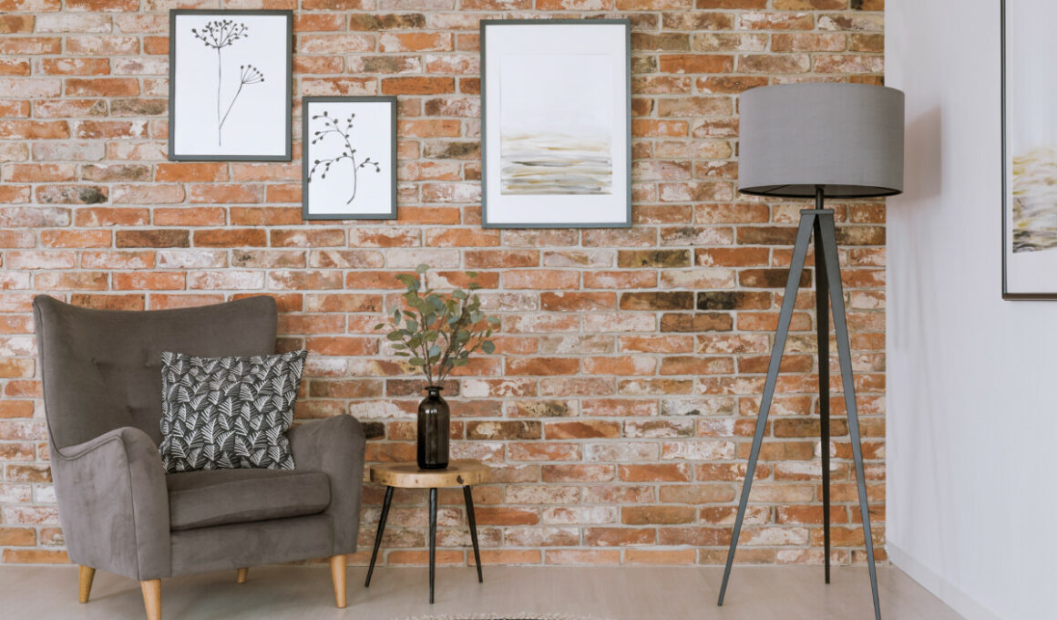 gray furniture against brick wall